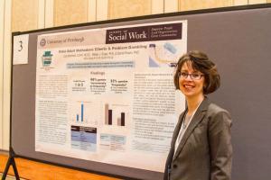 Jody Bechtold presents her research during the NCRG's poster session and reception.