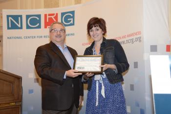NCRG Chairman Alan Feldman Awards the 2013 NCRG Outstanding Poster Award to Dr. Alyssa Wilson
